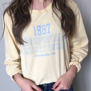 Yellow cropped long sleeve tee